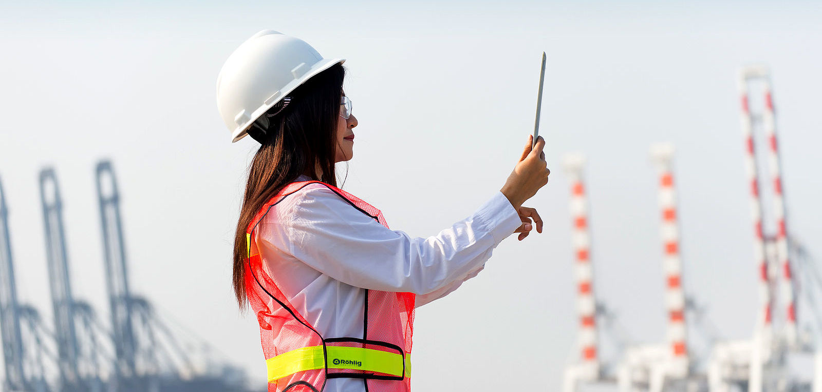 woman in hardhat and safety vest